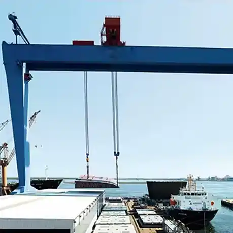 Large shipbuilding gantry crane with double beams operating at dock