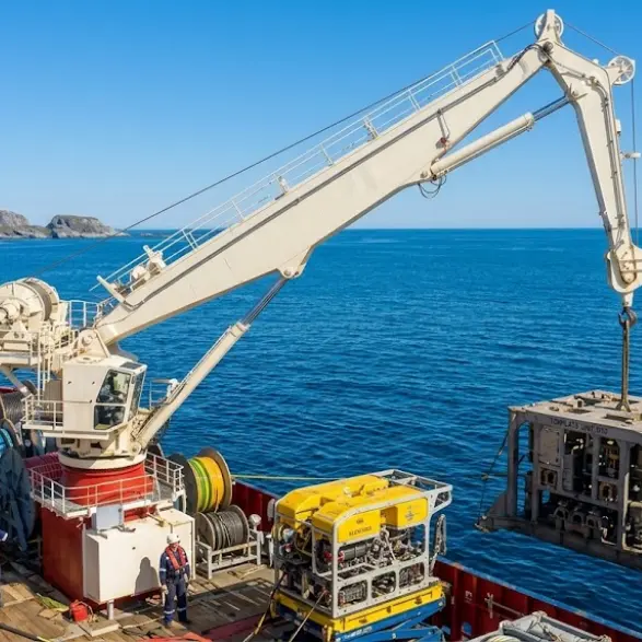 Offshore crane lifting heavy cargo at sea – durable marine deck crane for ships